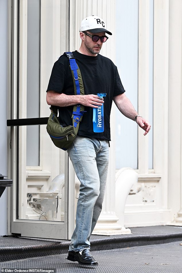 With a bag slung over his shoulder, the bearded pop star stepped out with a striking blue water bottle with the word 'Hydrated' on it in his hand.