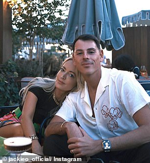 Jackie and Damien Dirizio (pictured with Jackie) cuddle up for a photo while sipping espresso martinis.