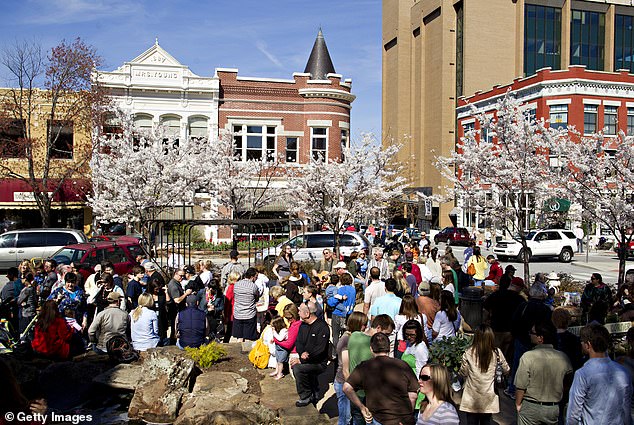 Fayetteville, Arkansas, made the list because of what it can offer nature-loving retirees (pictured: residents enjoy the Saturday morning farmers market in town)