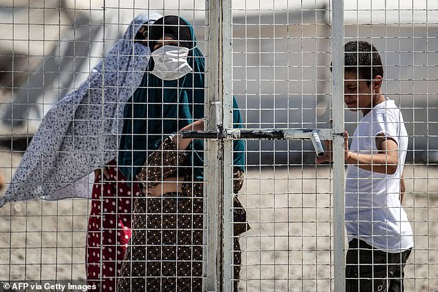 Al-Roj is home to around 2,600 detainees from 55 countries, many of them ISIS brides and their children (pictured: a woman in Al-Hol camp in northeastern Syria)