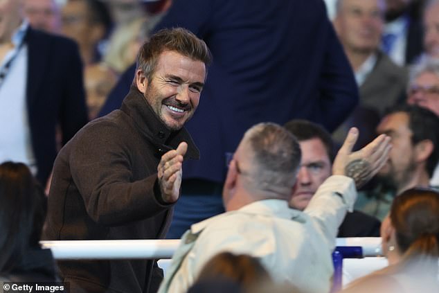 Beckham was warmly welcomed by home fans ahead of the League One match