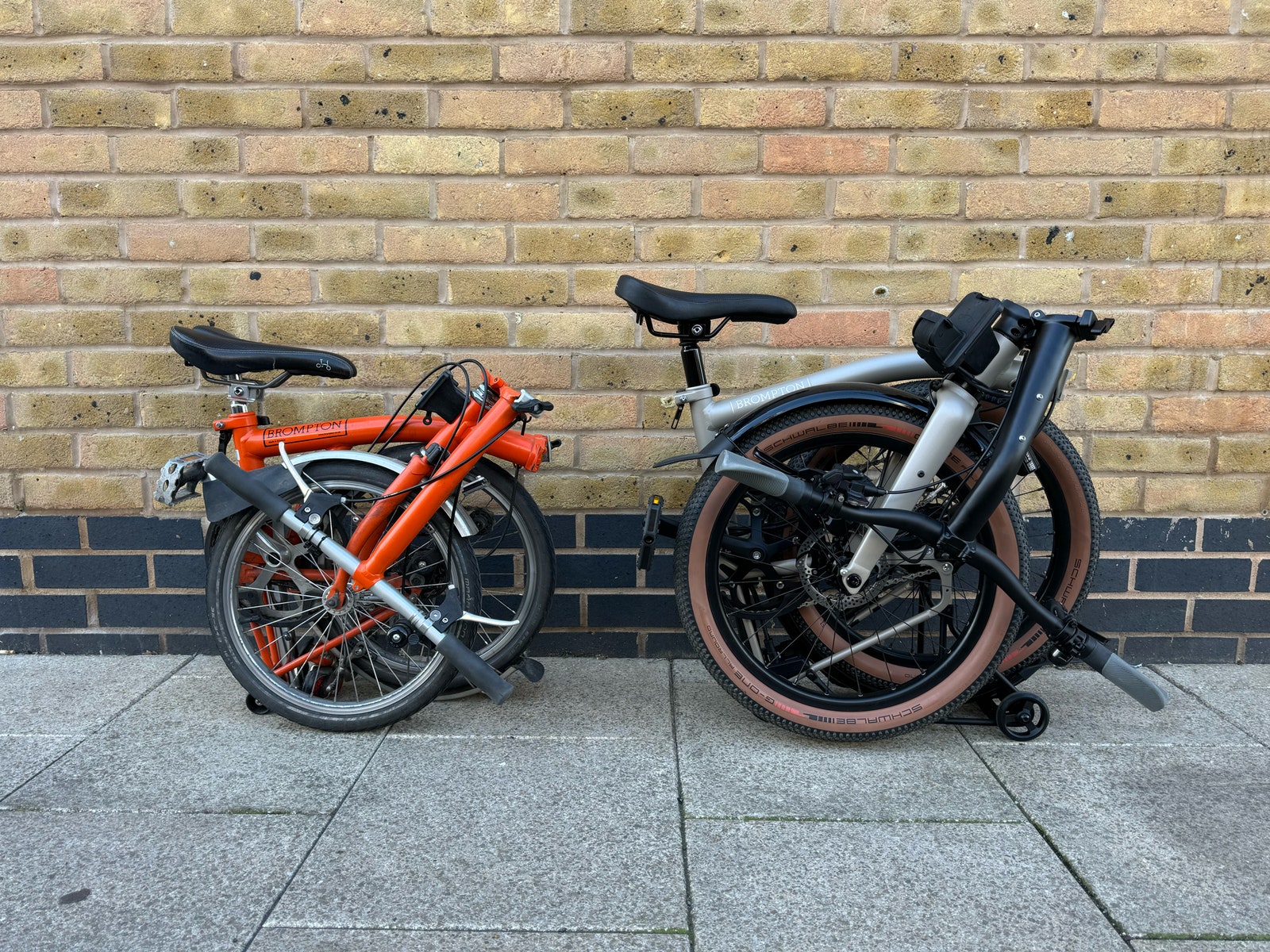 A side-by-side comparison of the Brompton GLine and the standard Brompton electric bike when folded