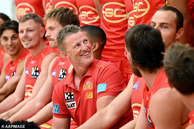 The Gold Coast Suns (coach Damien Hardwick, pictured) have met with Martin in an attempt to lure him out of retirement.