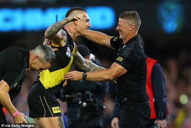 The Suns hope Martin's strong relationship with coach Hardwick (pictured together) will encourage him to continue playing for the Queensland club.