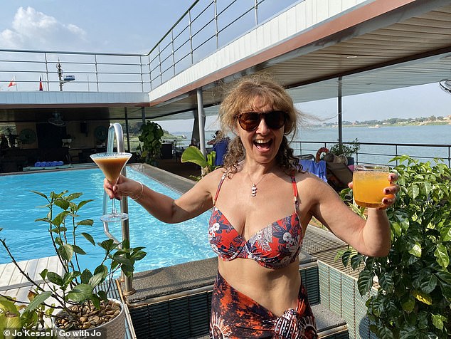 Pictured here, Jo is holding two of the ship's cocktails: the signature 'Rusty Nail' (right) and an espresso martini (left).