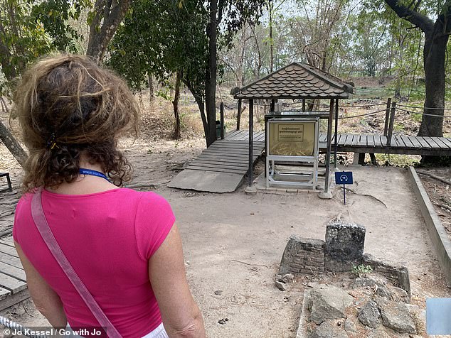 Jo is pictured in the Killing Fields during a tour from Phnom Penh, Cambodia, which she describes as a 