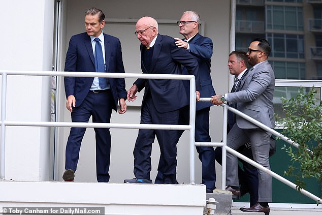 Murdoch arrived at the courthouse on Tuesday in a convoy of three SUVs and walked cautiously up the steps to a side entrance of the courthouse.