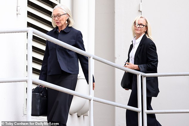 Prudence, 65, and Elizabeth walk down the catwalk into the building.