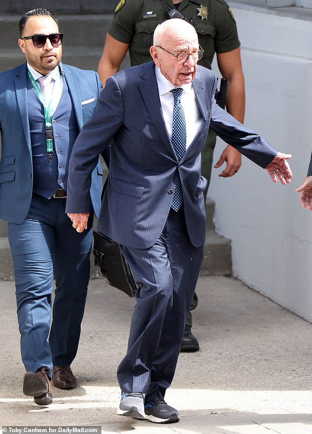 Murdoch leaves the hearing hours later through a back door at the 75th Judicial Courthouse in Reno, Nevada, on Tuesday.