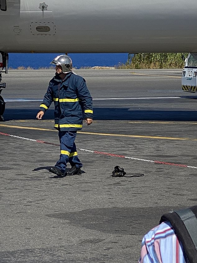 A power bank and e-cigarettes in a passenger's bag (pictured alongside the plane and emergency services) are believed to be the cause of the explosion which occurred shortly before take-off.