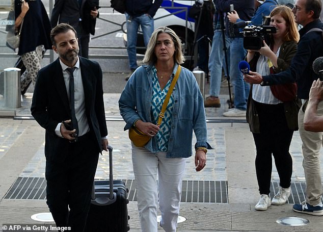 Caroline Darian (C) arrives at the trial of her mother's ex-partner on September 11