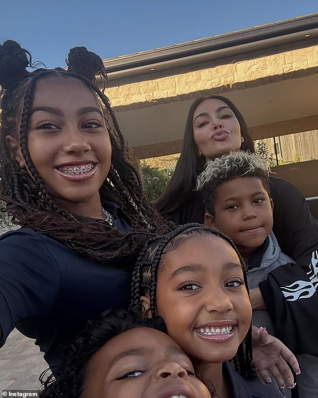 One photo showed her eldest daughter, North, 11, with her arm outstretched to take a selfie with her mother and three younger siblings: Saint, eight, Chicago, six, and Psalm, five.