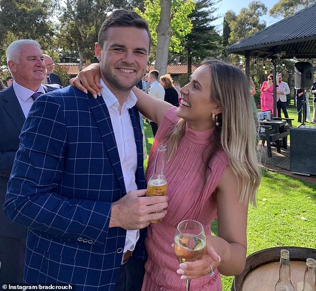 Crouch (pictured with wife Britt) only played one senior game in 2024 due to a knee injury.