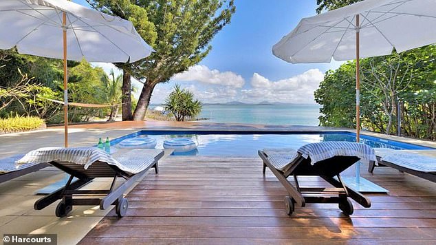 Little Green Island's main house features a pool with panoramic views of the Coral Sea.