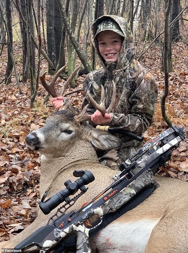 The two were deep in the woods of western Wisconsin, near the family's vacation cabin, when Owen first spotted the forest beast. Pictured: Owen on a hunting trip in November 2022