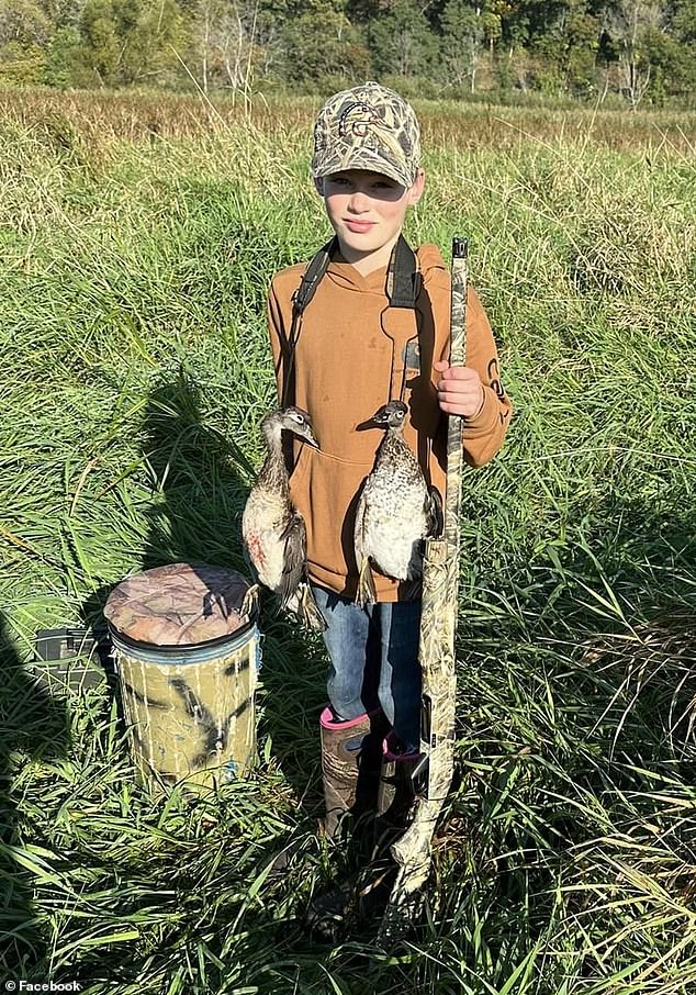 Owen, a regular hunter, was prepared for such an event, firing his rifle and killing the bear that would eventually fall off his father. Pictured: Owen carries the hunted birds around his neck on a hunting trip in October 2023