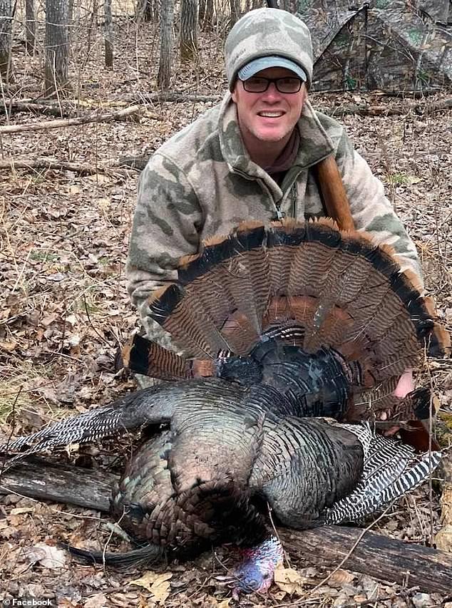 Ryan, 43, received 23 stitches in his cheek along with seven puncture wounds to his arm and another cut that needed stitching after the near-fatal bear attack. Pictured: Ryan with a hunted turkey on a hunting trip in April 2022