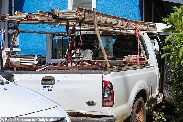 A white pickup truck in Routh's driveway has a Biden-Harris campaign sticker on the bumper.