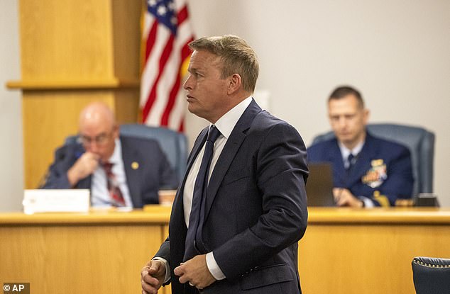 Former OceanGate marine operations director David Lochridge, center, stands during testimony Tuesday, Sept. 17, 2024, for Titan's formal marine board hearing inside the Charleston County Council Chambers in North Charleston, S.C.