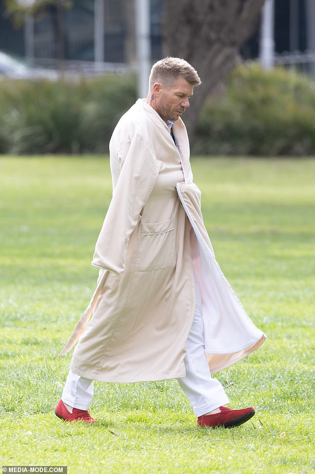 Between takes, David kept warm in a cozy robe.