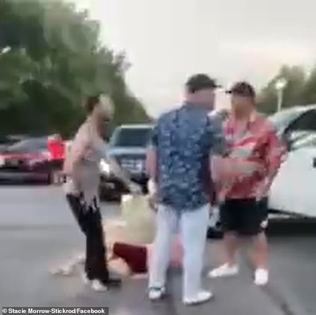 Raleigh was confronted in the video by Red Sox legend Kevin Youkilis (in blue), who had been dining at the same restaurant before the car crash that led to the incident.