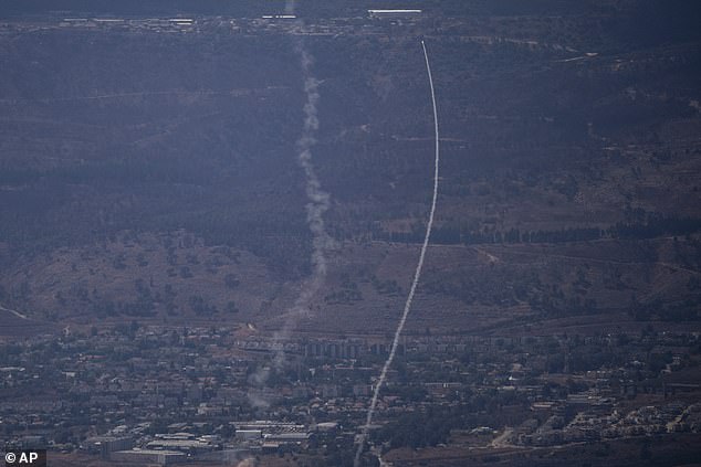 The Israeli Iron Dome air defense system fires to intercept an attack from Lebanon on the Galilee region near Kiryat Shmona, as seen from the Israeli-annexed Golan Heights, Tuesday, September 17, 2024.