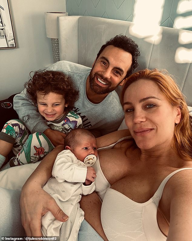 She was all smiles as she posed just weeks after giving birth to her second child, Carter, whom she shares with husband Cameron Merchant. The two are pictured with their sons Carter and Oliver.