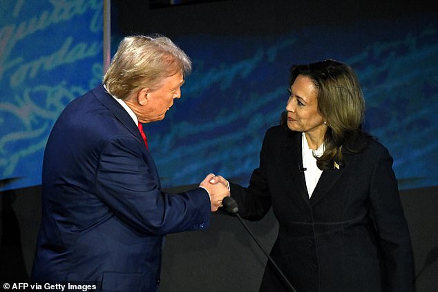 US Vice President and Democratic presidential candidate Kamala Harris (R) shakes hands with former US President and Republican presidential candidate Donald Trump during a presidential debate at the National Constitution Center in Philadelphia, Pennsylvania, September 10, 2024.