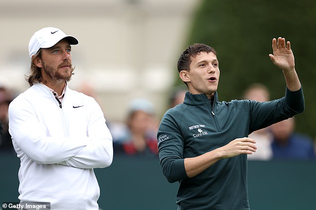 On Wednesday, Holland and his twin brothers Harry and Sam (not pictured) attended the event alongside professional golfer Tommy Fleetwood.