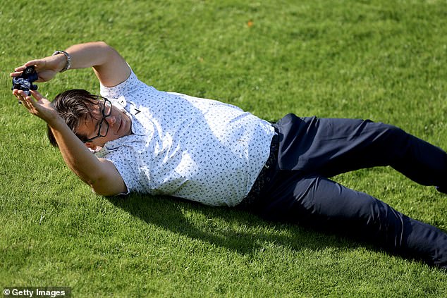 Comedian Michael McIntyre slid down a hill on the 18th hole during the Pro-Am competition