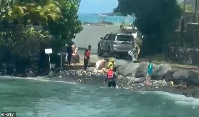 Rescuers desperately tried to resuscitate the young parents after they were pulled from the water.