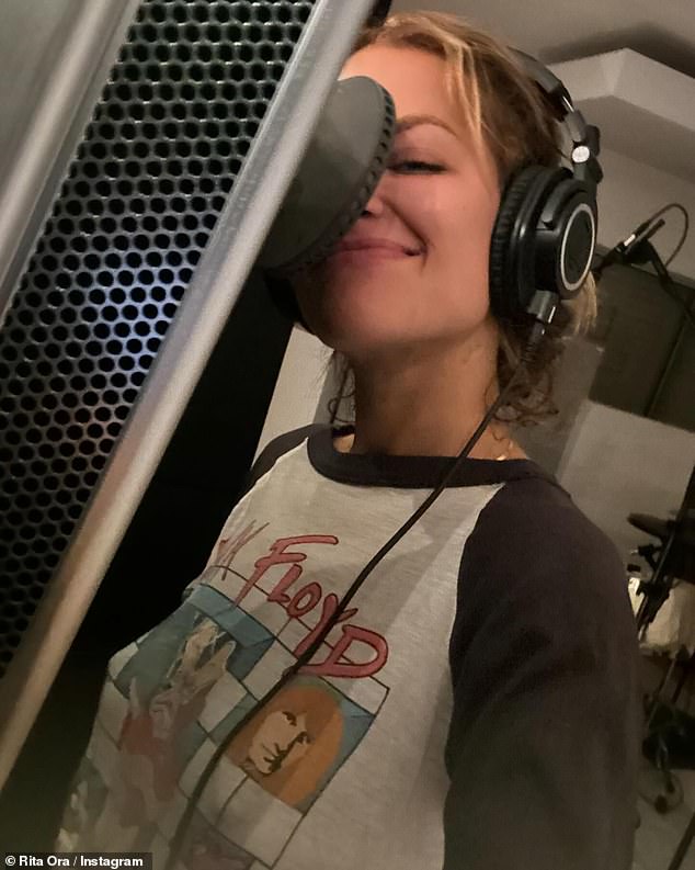 The hit singer also shared a photo of herself in the recording studio behind a microphone with headphones on and made a silly face as she captured herself working on her upcoming album.