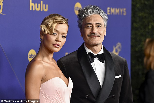 Rita's latest post comes just days after she was spotted putting on a dazzling display at the Emmy Awards with her husband of two years, Taika Waititi (pictured together).