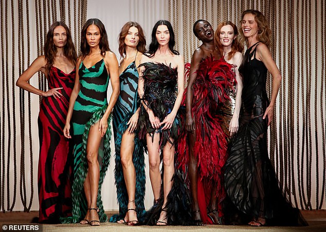 The models posed together with a smile at the end of the show, showing off their range of styles. Pictured are LR Natasha Poly, Joan Smalls, Isabeli Fontana, Mariacarla Boscono, Alek Wek, Karen Elson and Eva Herzigova.