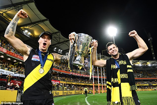 The former Tigers captain (pictured celebrating the win with Martin) wants 'Dusty' to remain a one-club man after his glittering career in black and yellow.