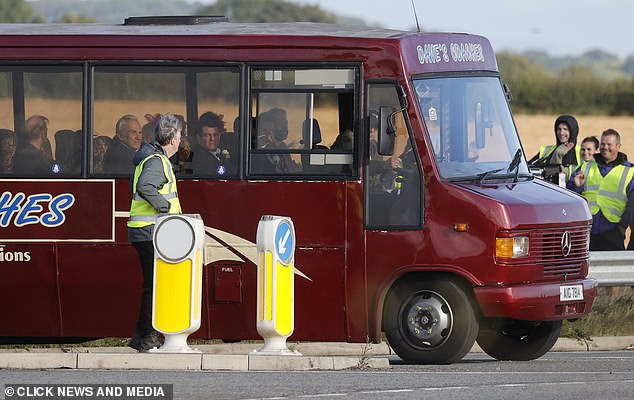 Spectators watched as the group was towed out of a field, adding a bit of real comedy to the day's events.