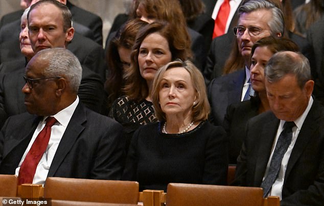 Justice John Roberts, front right, with his wife Jane Sullivan, center, at the memorial service for former Supreme Court Justice Sandra Day O'Connor in December of last year.