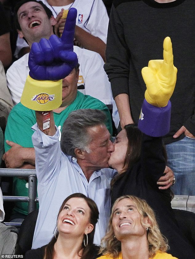 Keeping the romance alive: The couple is seen sharing a passionate kiss at the 2010 NBA Finals.