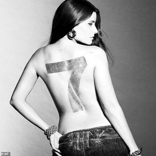 Furtado poses with the number seven on her back for her new album