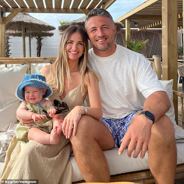 Burgess (pictured with partner Lucy Graham and daughter Robbie) is a rookie manager at Warrington but has led the club to the final in his first year.