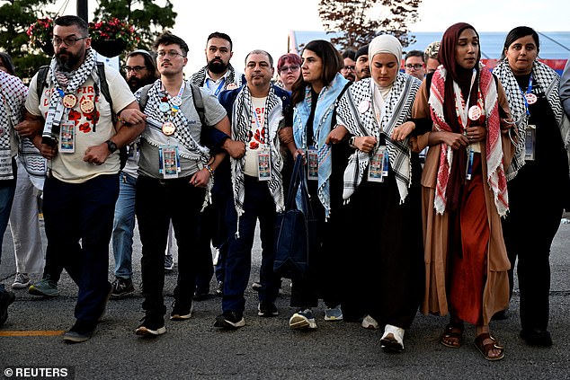 Members of the Uncommitted movement march at the Democratic National Convention. Leaders said Thursday they would not endorse Vice President Kamala Harris, but also encouraged their followers not to vote for a third party because that could help former President Donald Trump.