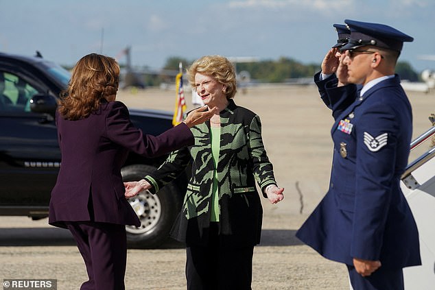 Vice President Kamala Harris (left) greets Michigan Sen. Debbie Stabenow (center) on the tarmac at Joint Base Andrews, during her trip to Michigan on Thursday. Michigan is where the Uncommitted Movement's lack of support could have the biggest impact