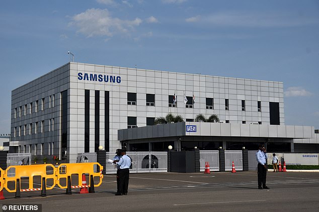 Security guards stand outside a Samsung facility near the city of Chennai, India, on September 16, 2024.