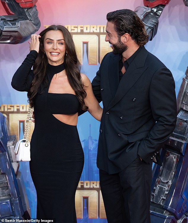 Sparks flew on the red carpet as Henry made Kady laugh in front of the cameras.