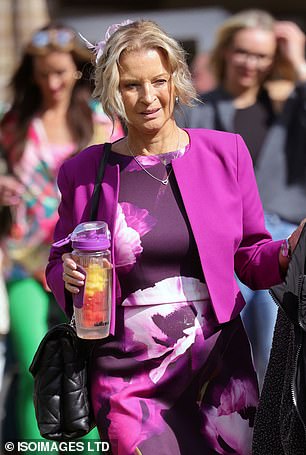 The star showed off her age-defying figure in a pink and purple dress and matching jacket.