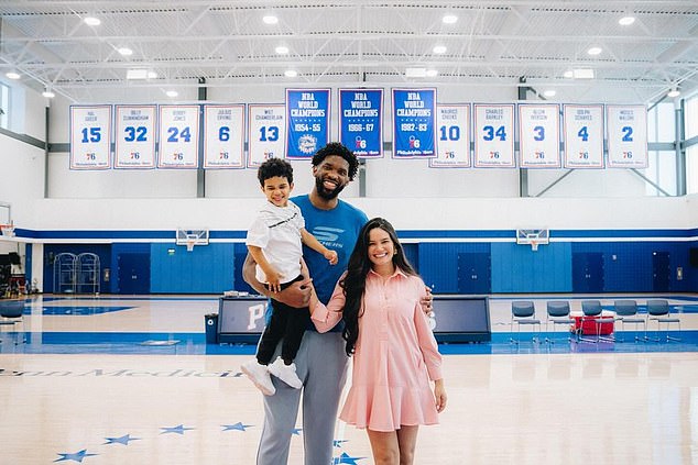 Embiid signed his new contract alongside his wife Anne de Paula and his four-year-old son Arthur.