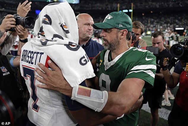 Opposing quarterback Jacoby Brissett received a hug on the field after the Jets' big win.