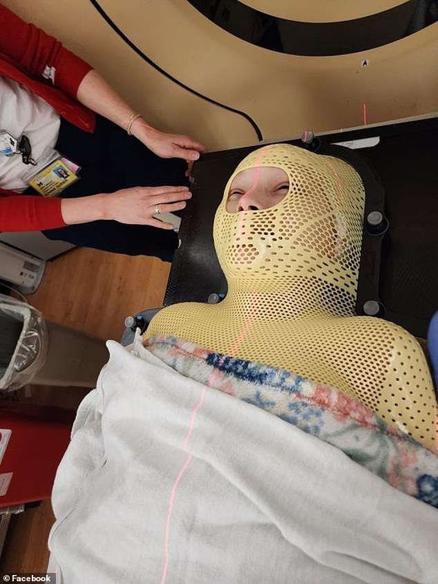 Ms Rhodes spent nine months in and out of hospital receiving chemotherapy and radiotherapy to treat her cancer. She is pictured above during treatment.