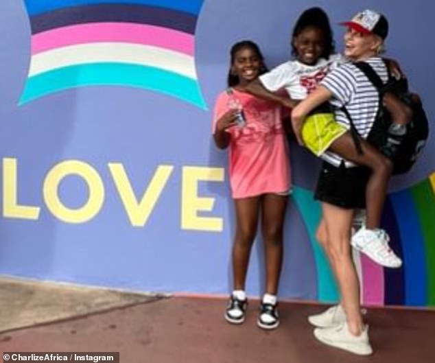 The actress with her children at Disney World earlier this year.