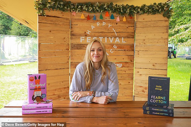 Fearne Cotton (pictured) poses in Chiswick Gardens with her newly released novel, Scripted